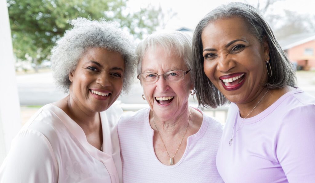 A Group of senior women smiling and posed for a photo